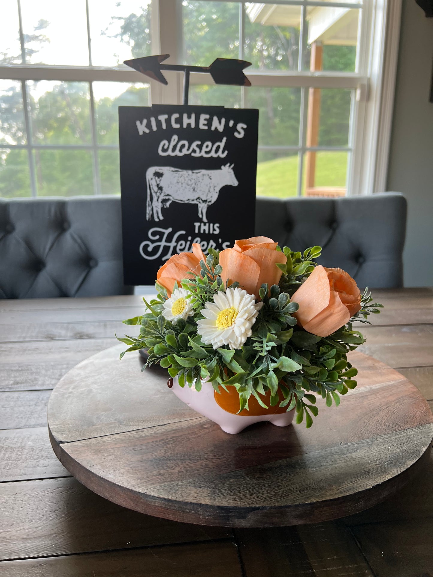 Hedgehog with orange roses and daisy wood flowers