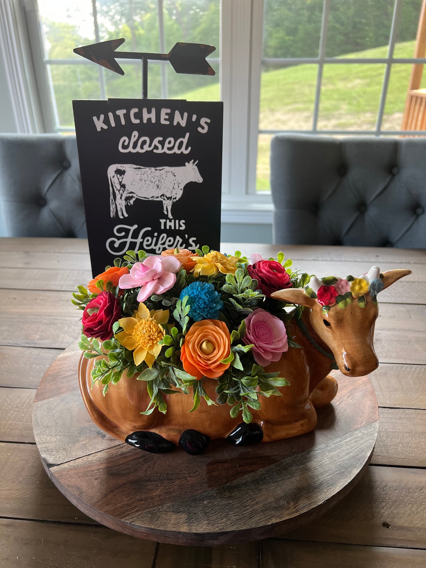 COW WITH PINK,BLUE ,ORANGE,YELLOW AND RED WOOD FLOWERS