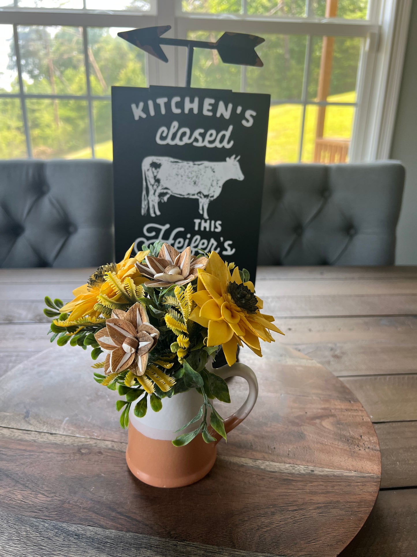 Mini white and terra cotta pitcher with yellow sunflowers