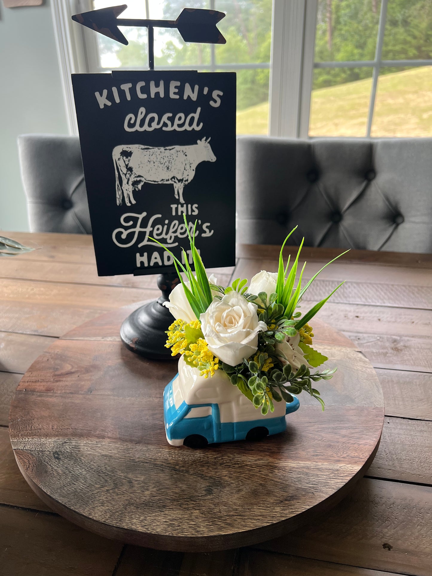 Camper with pink wood flowers