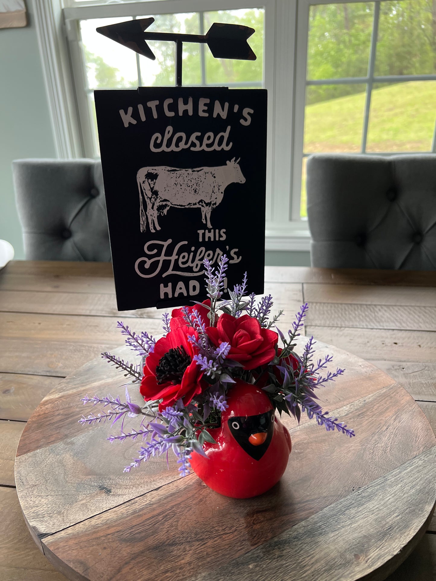 Cardinal with red flowers