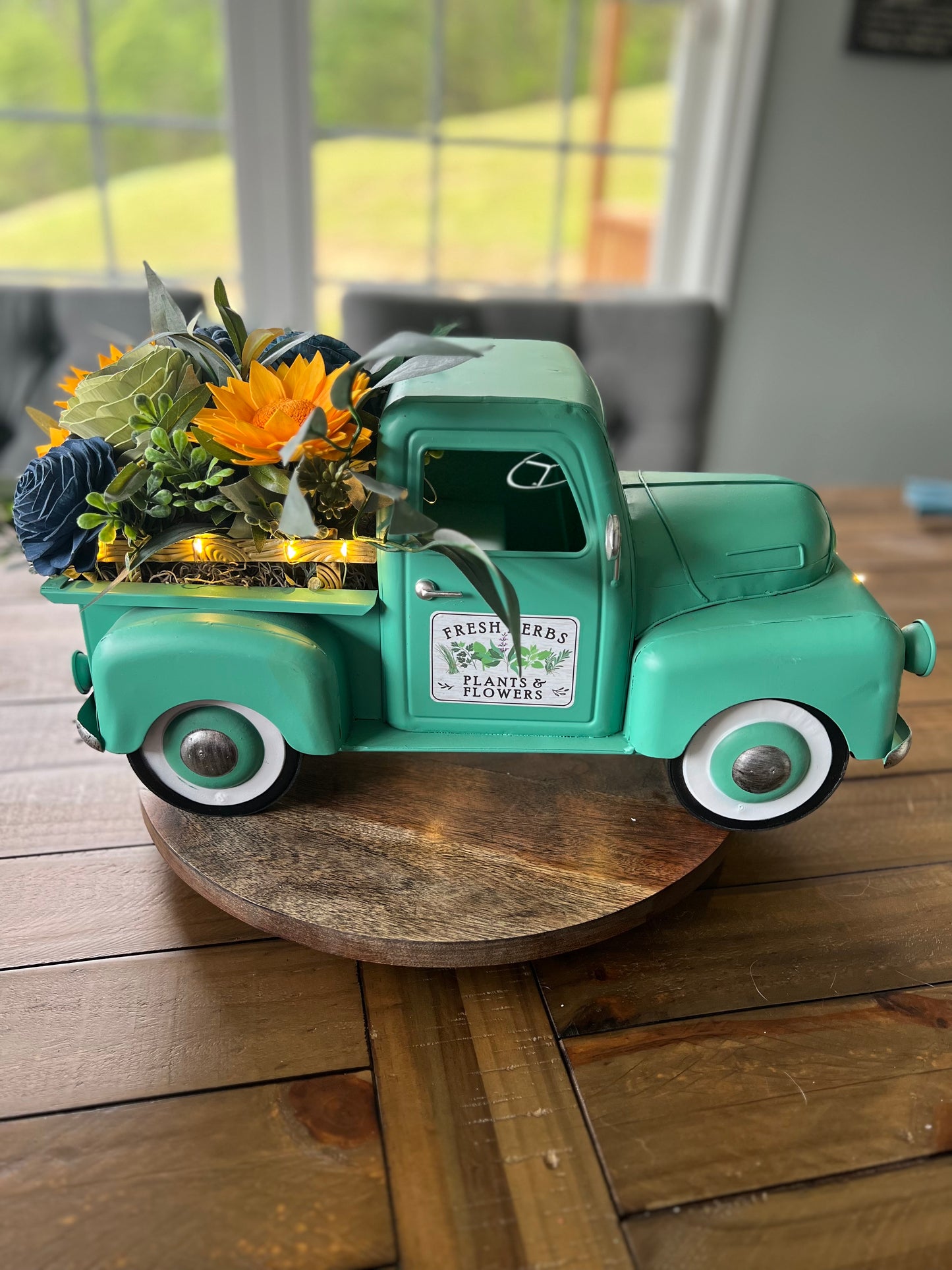 TEAL TRUCK FLORAL ARRANGEMENT WITH WORKING LIGHT