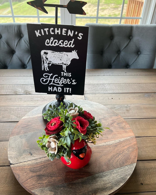 Cardinal with red flowers