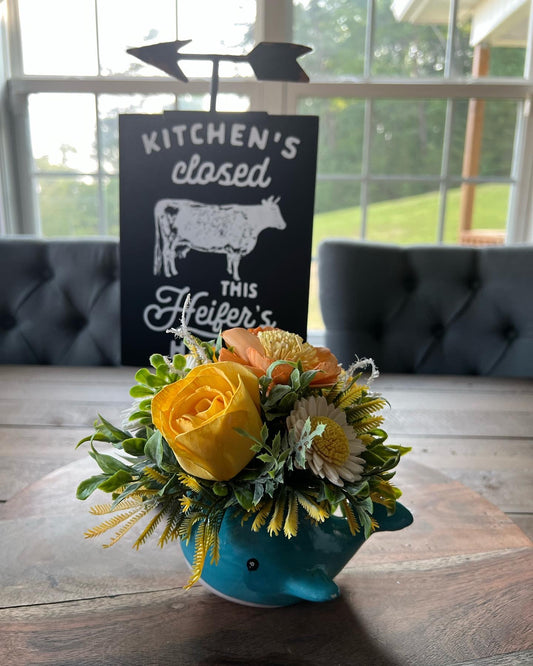 Whale with yellow and peach flowers