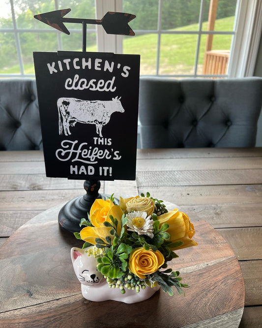 Cat with  yellow flowers