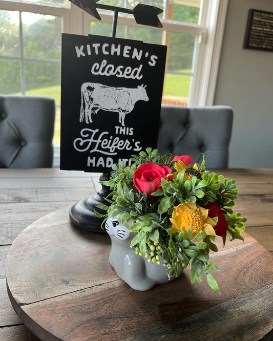 Sea Lion  with red and yellow flowers