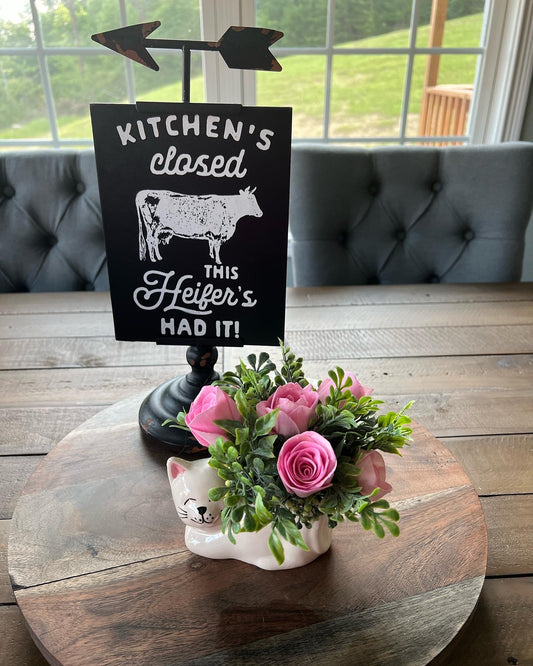 Cat with pink flowers