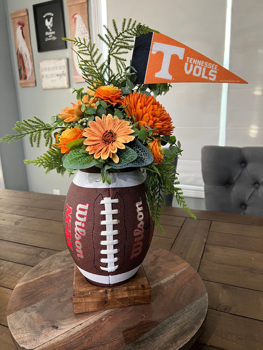 Go Vol’s Football arrangement on a wood stand