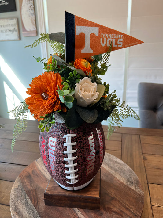 Go Vol’s Football arrangement on a wood stand