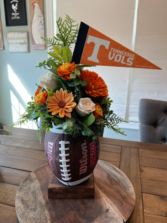 Go Vol’s Football arrangement on a wood stand